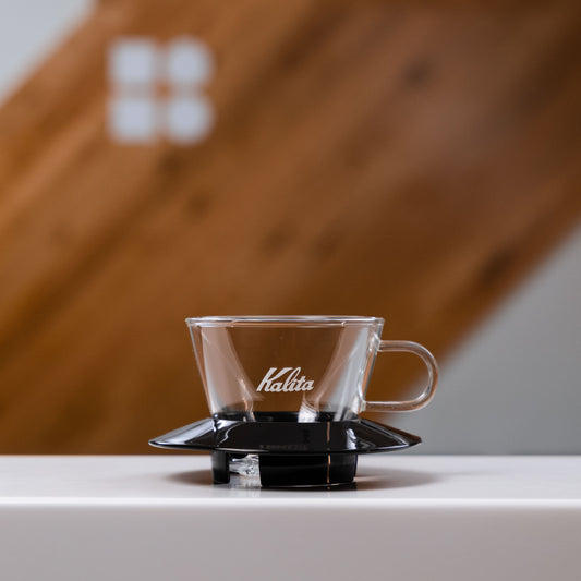 Glass kalita dripper with black plastic bottom